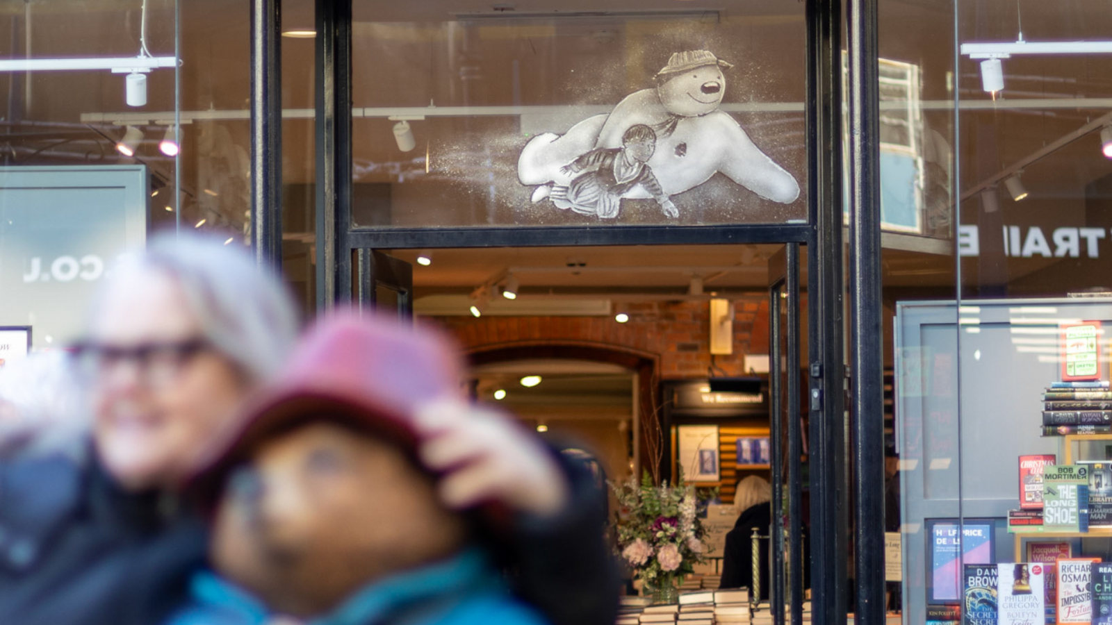 Snowman snow window about Waterstones sign
